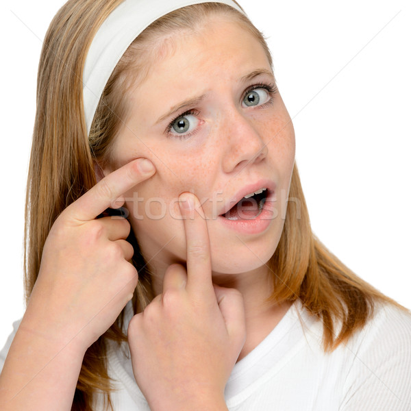 Teen girl looking skin spotted pimple squeezing Stock photo © CandyboxPhoto