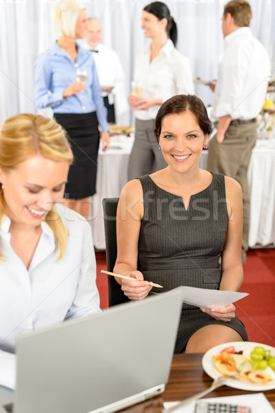 Business woman work during company buffet Stock photo © CandyboxPhoto