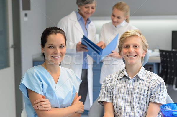 Dental team at stomatology clinic with teenager Stock photo © CandyboxPhoto