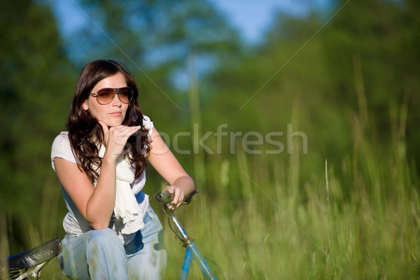 Stock photo: Woman with old-fashioned bike in summer meadow