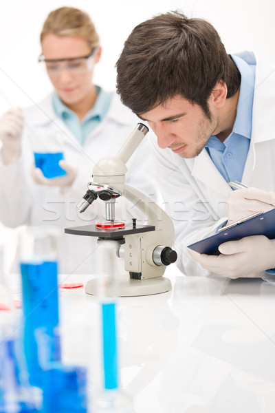 Flu virus experiment -  scientist in laboratory Stock photo © CandyboxPhoto