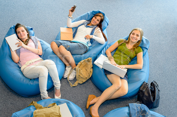 Group of students relax on beanbag Stock photo © CandyboxPhoto