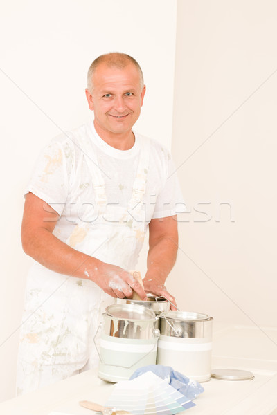 Stock photo: Home decorating mature male painter color swatches
