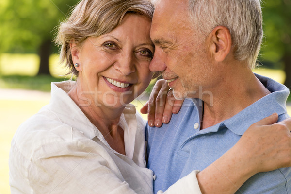 Elderly wife and husband cuddling outdoors Stock photo © CandyboxPhoto