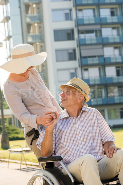 Senior wife with disabled husband on wheelchair Stock photo © CandyboxPhoto