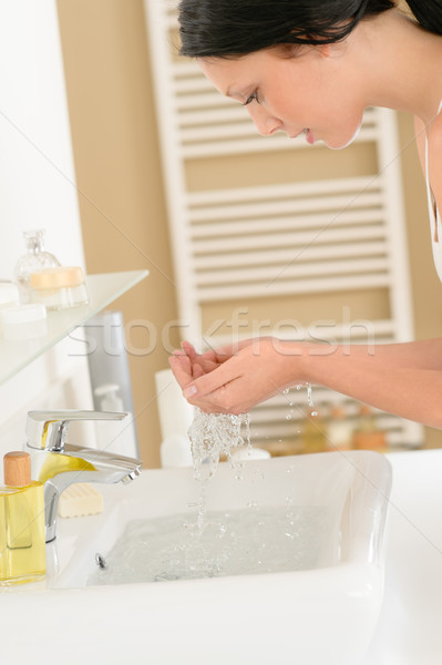 Woman wash face at basin bathroom Stock photo © CandyboxPhoto