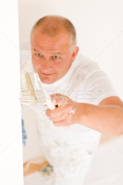 Home decorating mature man painting wall brush Stock photo © CandyboxPhoto