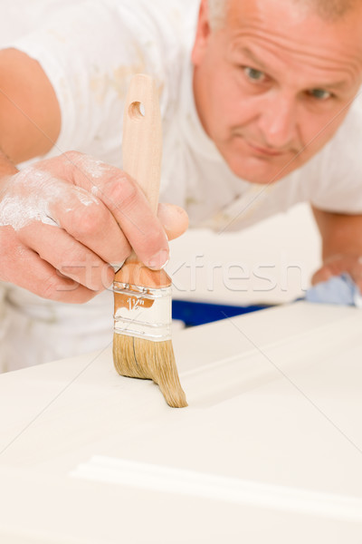 Home decorating mature man painting door brush Stock photo © CandyboxPhoto