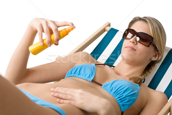Plage jeune femme bronzage lotion bikini lunettes de soleil Photo stock © CandyboxPhoto