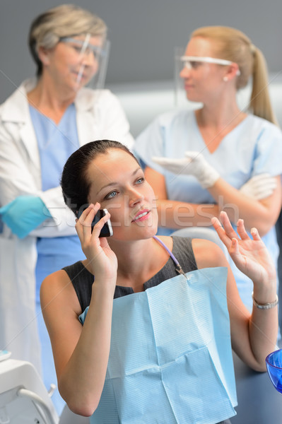 Busy woman patient calling at dentist office Stock photo © CandyboxPhoto