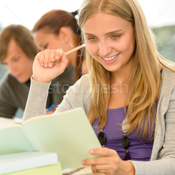 Stock photo: High-school student taking notes in library study