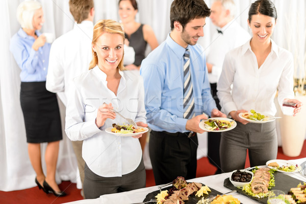 Business colleagues serve themselves at buffet Stock photo © CandyboxPhoto