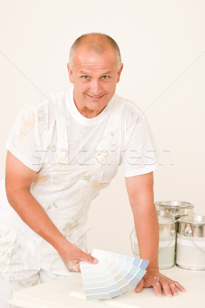 Stock photo: Home decorating mature male painter color swatches