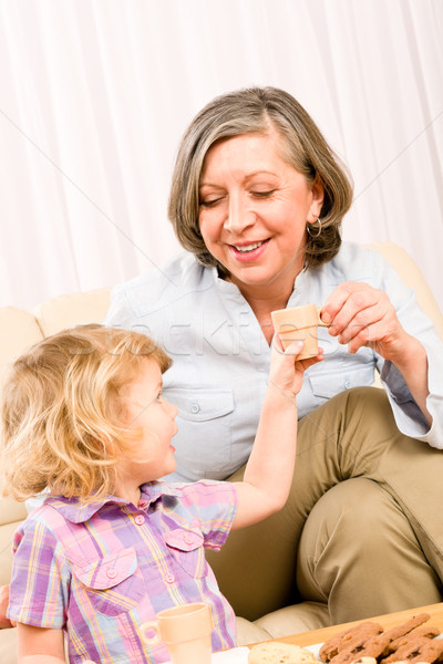 Nagymama leányunoka ital pici csészék kislány Stock fotó © CandyboxPhoto