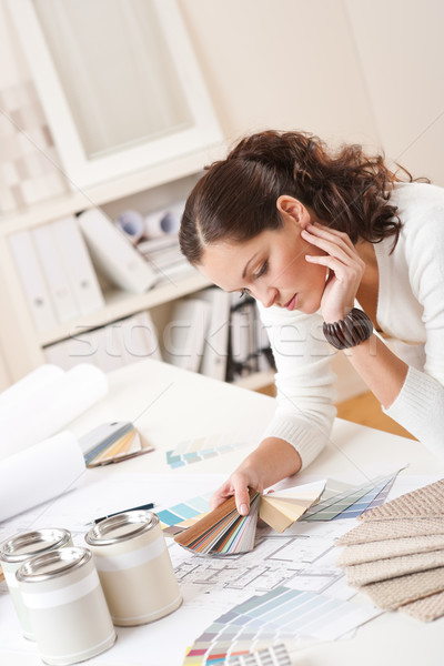 Stock photo: Young female interior designer at office