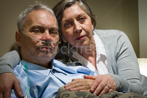 Anxious senior wife holding her sick husband Stock photo © CandyboxPhoto