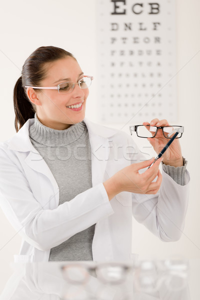 Stock photo: Optician doctor woman with glasses and eye chart