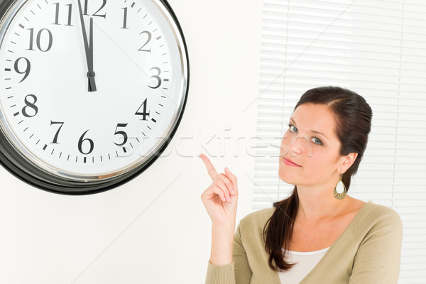 Punctual businesswoman attractive point at clock Stock photo © CandyboxPhoto