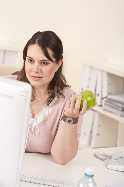 Young happy businesswoman holding apple at office Stock photo © CandyboxPhoto