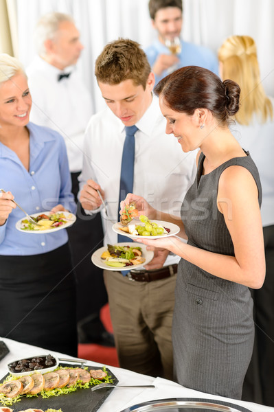 Business colleagues eat buffet appetizers Stock photo © CandyboxPhoto
