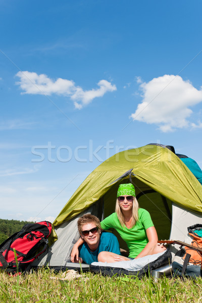 Stock photo: Camping couple lying inside tent summer countryside