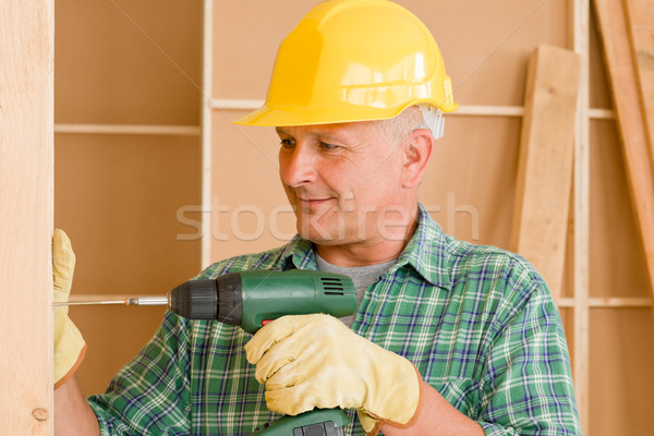 Handyman home improvement working with screwdriver Stock photo © CandyboxPhoto