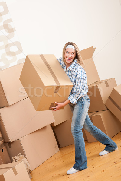 Moving house: Woman holding big carton box Stock photo © CandyboxPhoto