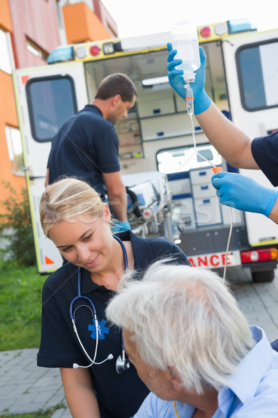 Paramedical team helping injured patient on street Stock photo © CandyboxPhoto