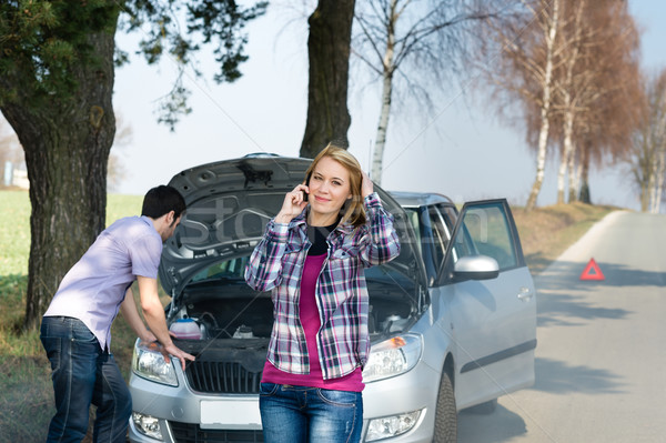 Stock photo: Car breakdown couple calling for road assistance