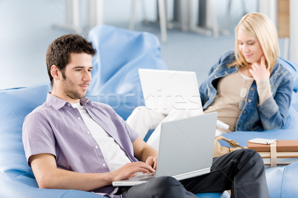 Stock photo: Young students at high-school working on laptop