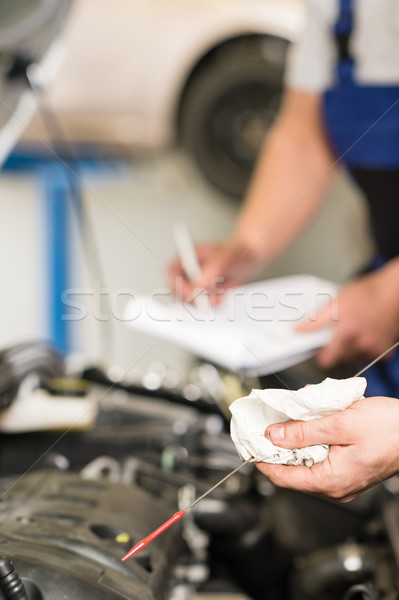 Hand of car mechanic holding dipstick Stock photo © CandyboxPhoto