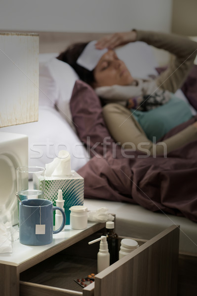 Flu medicines on bedside table ill woman Stock photo © CandyboxPhoto