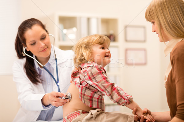Pediatrician examine child girl with stethoscope Stock photo © CandyboxPhoto
