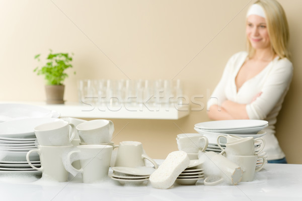 Stock photo: Modern kitchen - happy woman washing dishes 