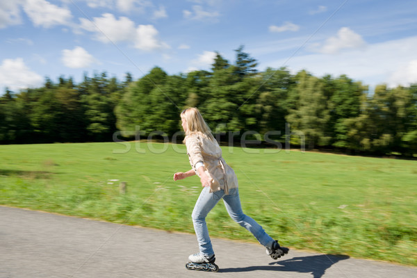 Inline skating young woman speed workout sunny Stock photo © CandyboxPhoto
