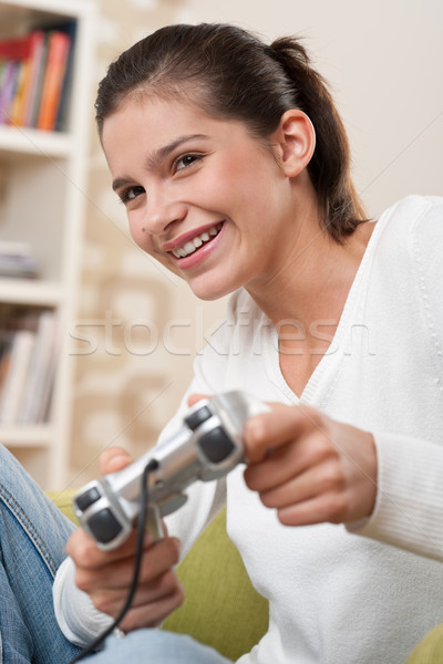 Stock photo: Students - Female teenager playing video game