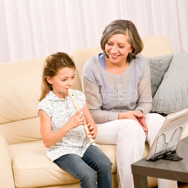 Grandmother teach young girl play flute happy Stock photo © CandyboxPhoto