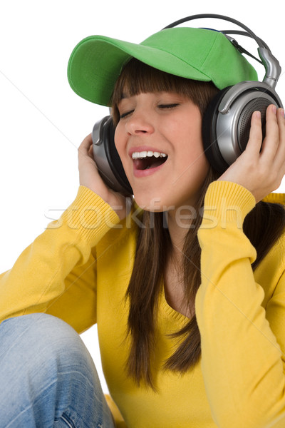 Stock photo: Happy female teenager enjoy music