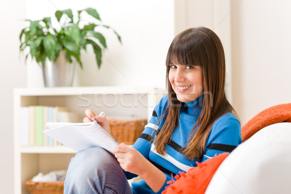 Stock photo: Teenager girl home - student write homework