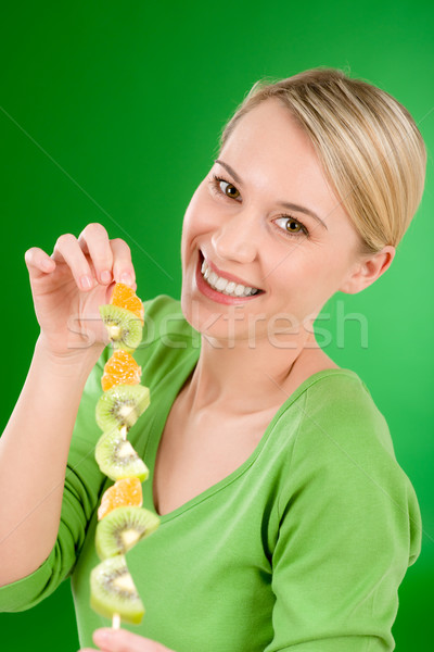 Foto stock: Mulher · alimentação · kiwi · laranja · vara