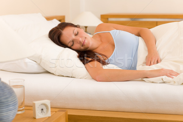 Alarm clock Woman sleeping in white bed Stock photo © CandyboxPhoto