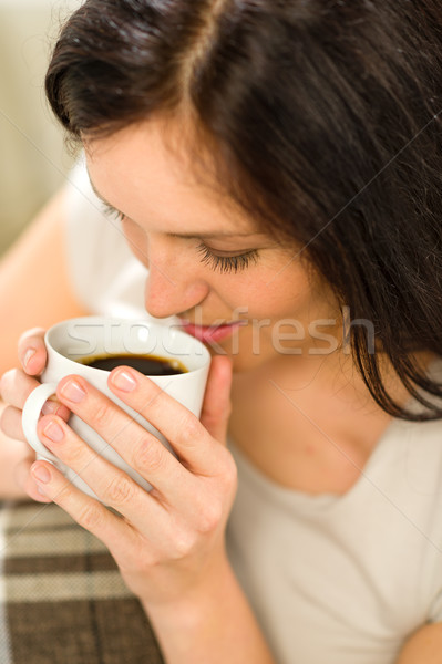 Relaxing woman drinking hot beverage for enjoyment Stock photo © CandyboxPhoto