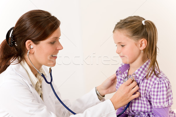 Female doctor examining child with stethoscope Stock photo © CandyboxPhoto