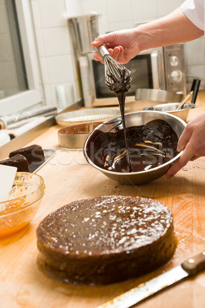 Cook kitchen dripping chocolate sauce for cake Stock photo © CandyboxPhoto