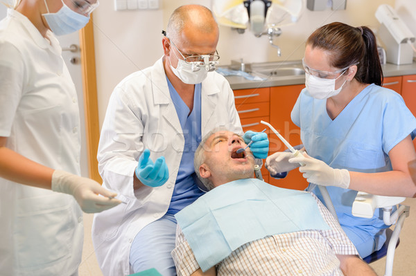 Stock photo: Senior man at dentist surgery have operation