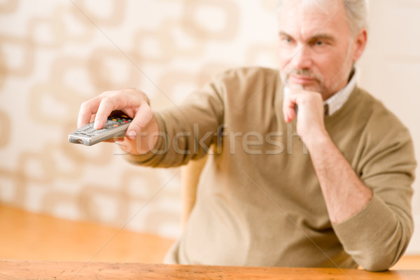 Senior mature man with remote control  Stock photo © CandyboxPhoto