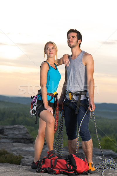 Rock climbing active couple on top sunset Stock photo © CandyboxPhoto