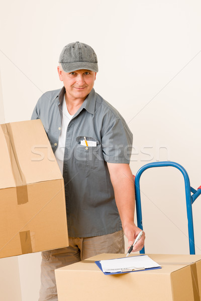 Stock photo: Messenger mature male courier delivering parcels