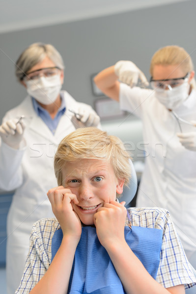 Stock photo: Scared teenage boy at dental surgery dentist