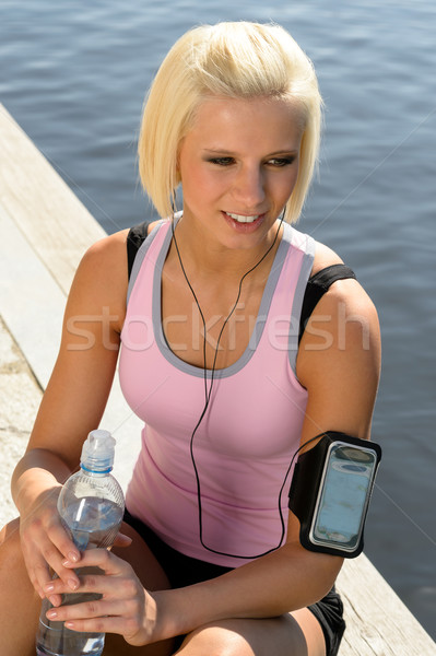 Sport donna sorridente relax acqua seduta pier Foto d'archivio © CandyboxPhoto